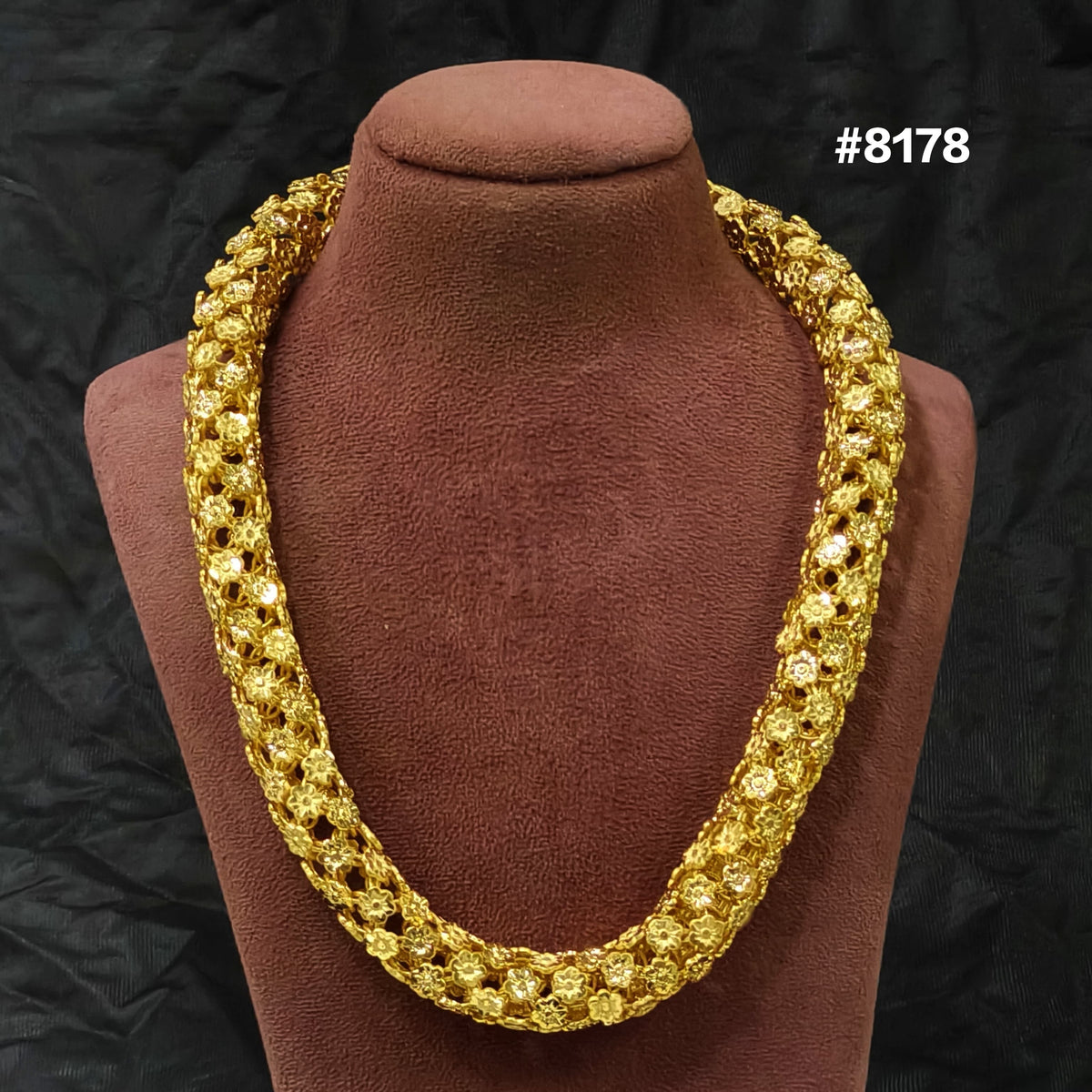 A thick, intricately designed gold necklace is displayed on a brown velvet bust, set against a black background. The number #8178 appears in white text in the top right corner.