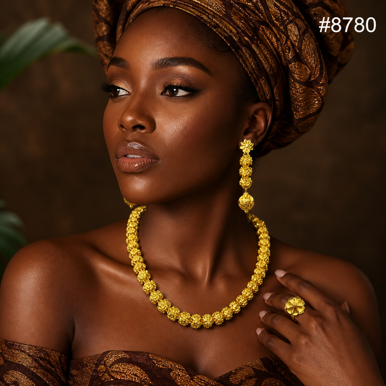 Portrait of a poised Black woman in a patterned headwrap and brown dress, wearing ornate gold jewelry; warm, elegant beauty editorial, #8780.