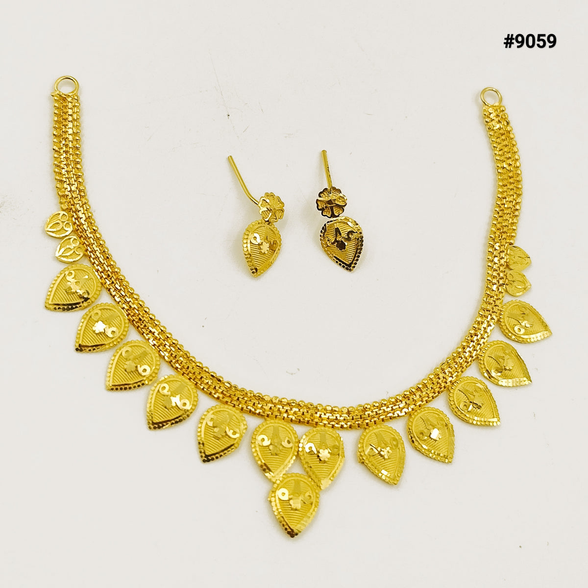 Gold-toned necklace and matching earrings with ornate heart and teardrop charms, displayed on white; elegant jewelry set #9059.