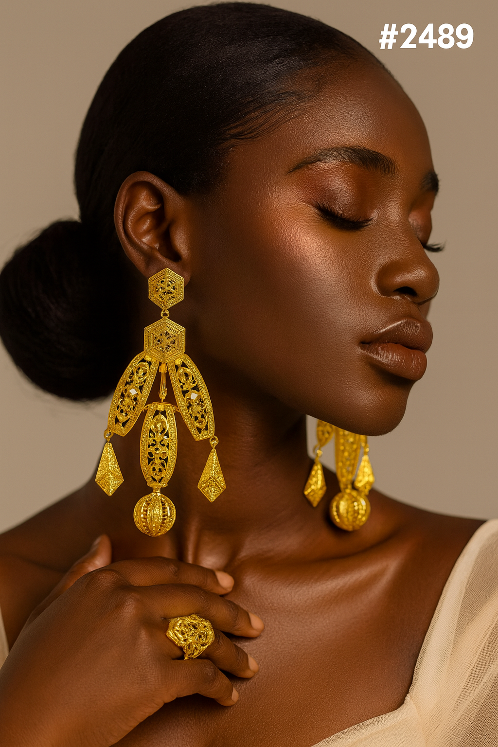 Close-up portrait of a Black woman with closed eyes, ornate gold chandelier earrings and ring, touching a cream drape against a warm backdrop. #2489