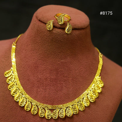 Gold necklace and earrings on a brown mannequin with a black background