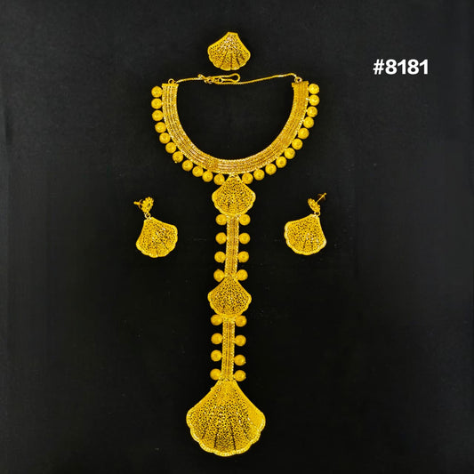 Gold necklace and earrings set on a black background