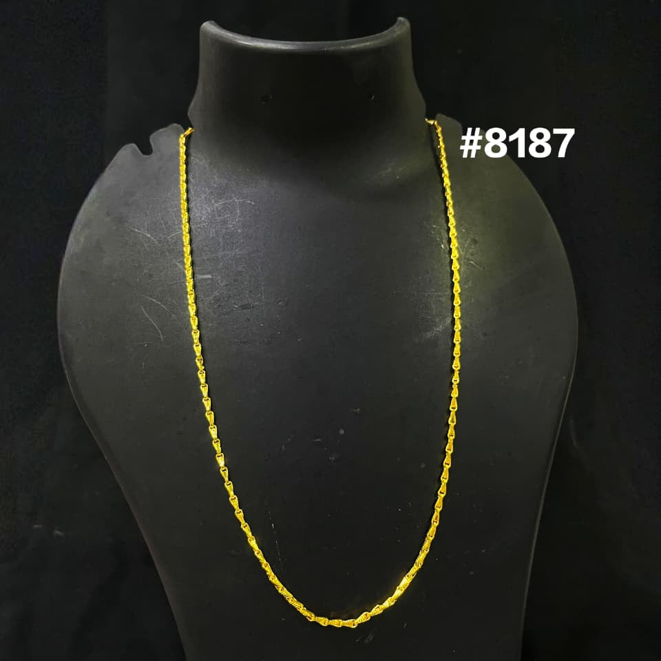 Yellow necklace on a black mannequin with a dark background