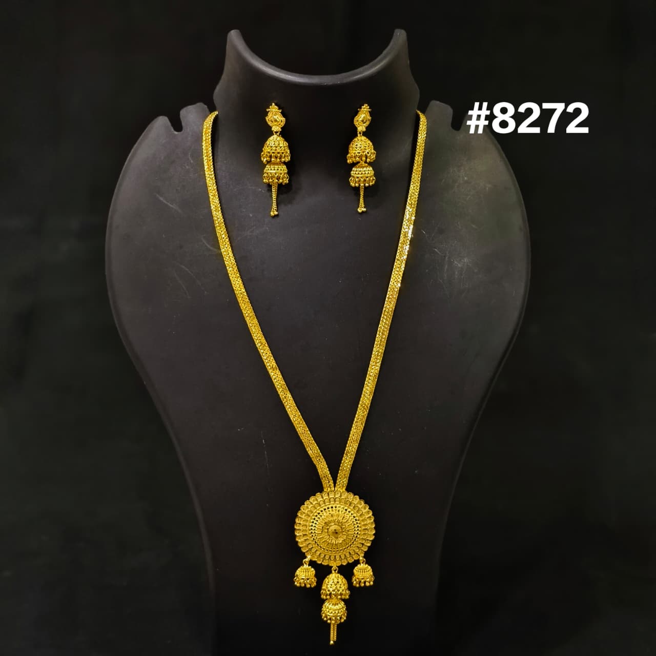 Gold necklace and earrings set on a black stand with '#8272' text.