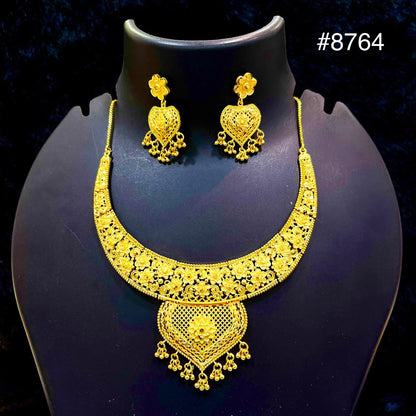 A gold necklace and matching earrings with intricate floral and heart-shaped designs displayed on a black stand. The image has the number #8764 in the top right corner.