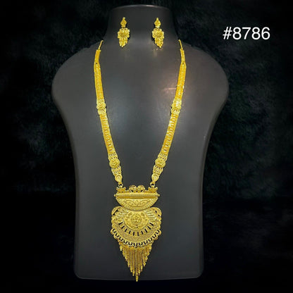 Gold necklace with an intricate, ornate pendant and matching earrings displayed on a black bust, set against a black background. The number #8786 is shown in the top right corner.