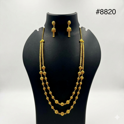 Gold-plated jewelry set displayed on a black stand, featuring a double-layered beaded necklace and matching drop earrings, with the number #8820 in the top right corner.