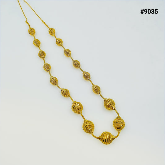 Gold beaded necklace with textured spherical beads and larger ornate pendants on a white background; elegant jewelry product #9035.